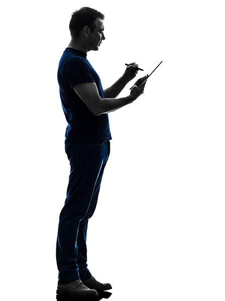 man holding digital tablet silhouette